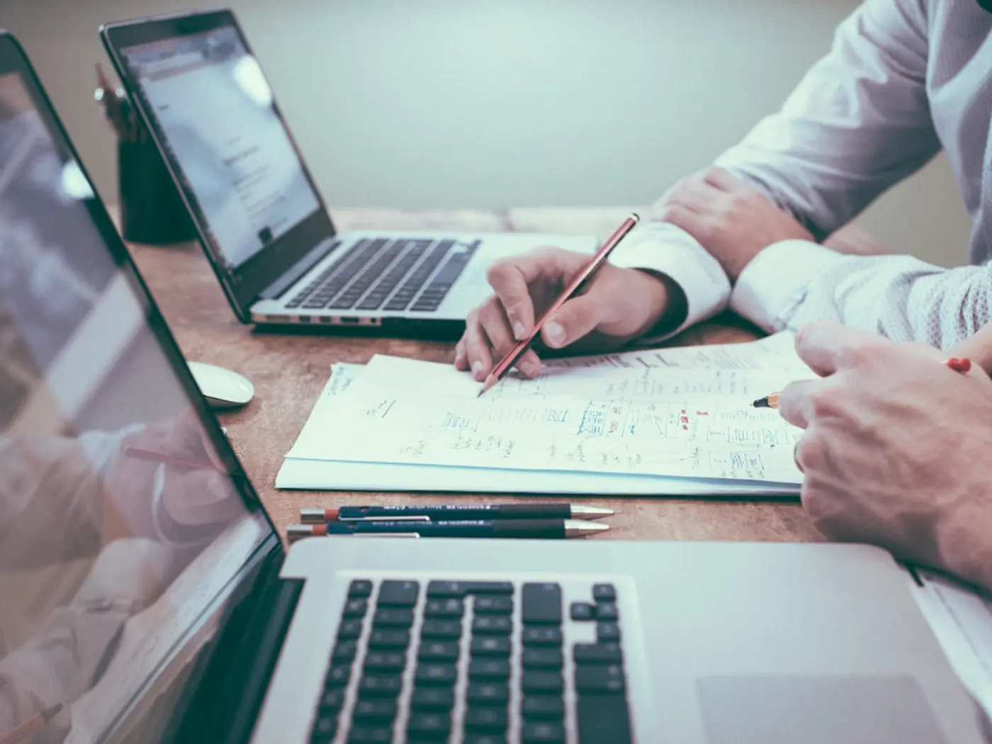 HR professional preparing workplace documentation on a laptop